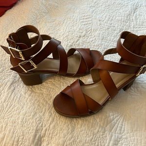 Tan strapped sandal worn a handful of time but great condition.